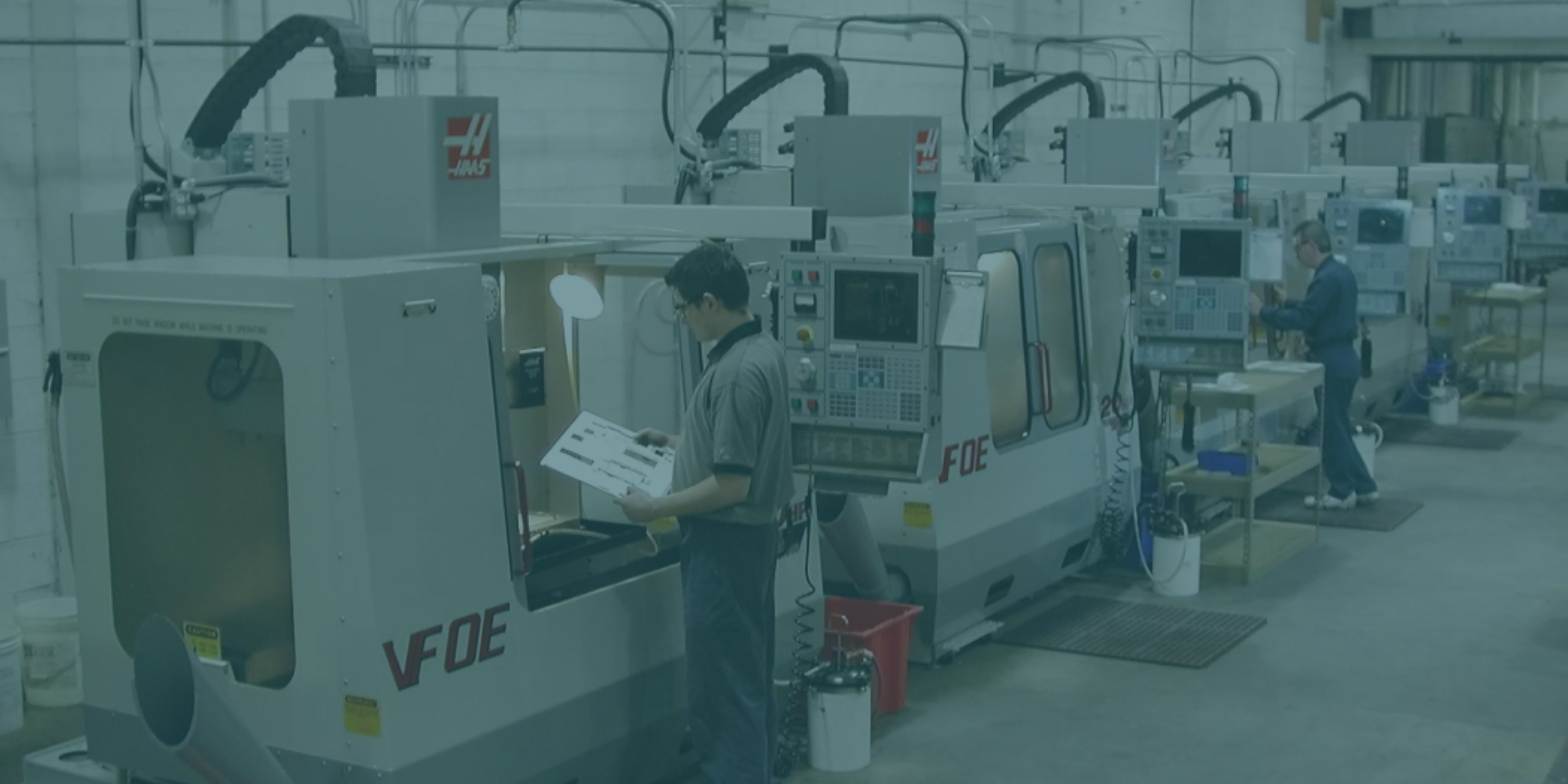 Machinist checking a document.